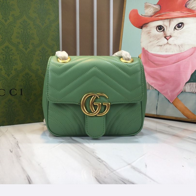 G*u*i clutch bags